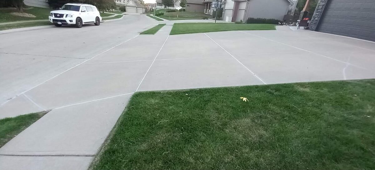 New concrete driveway with clean saw-cut joint lines in Omaha